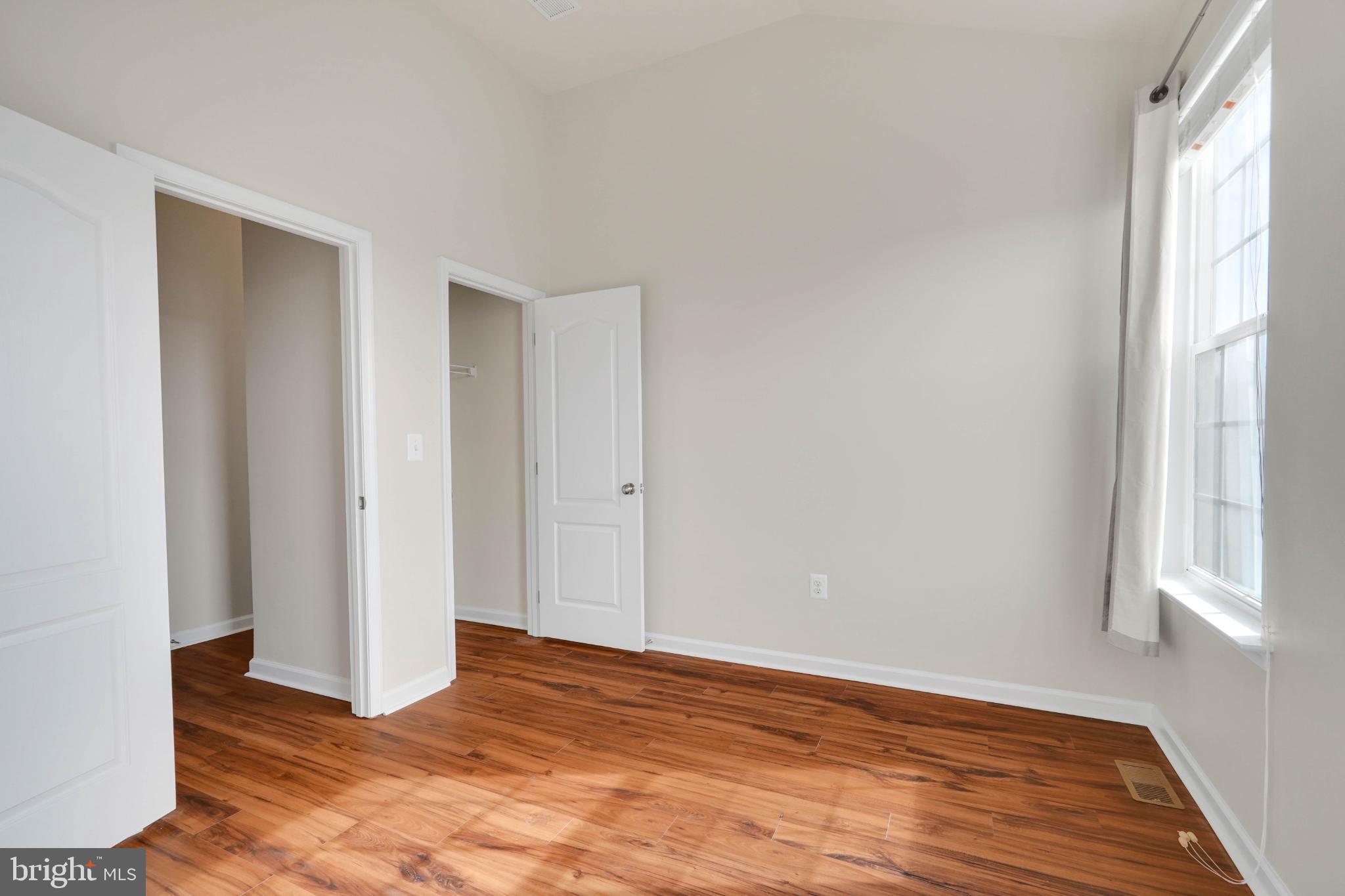 6 Lamplighter Lane Stafford, VA 22554 - Photo 19 of 37 a view of an empty room with wooden floor and a window