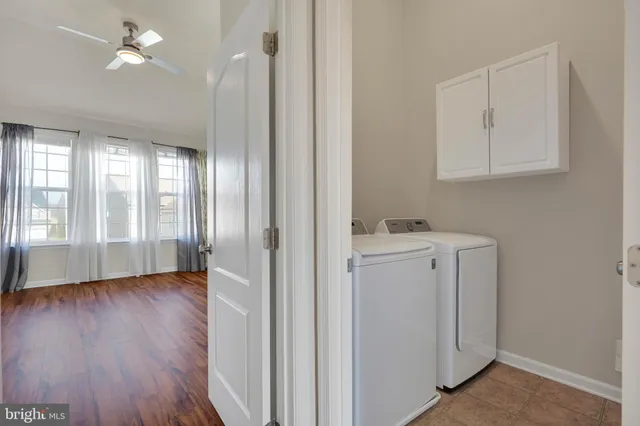 a view of hallway with wooden floor