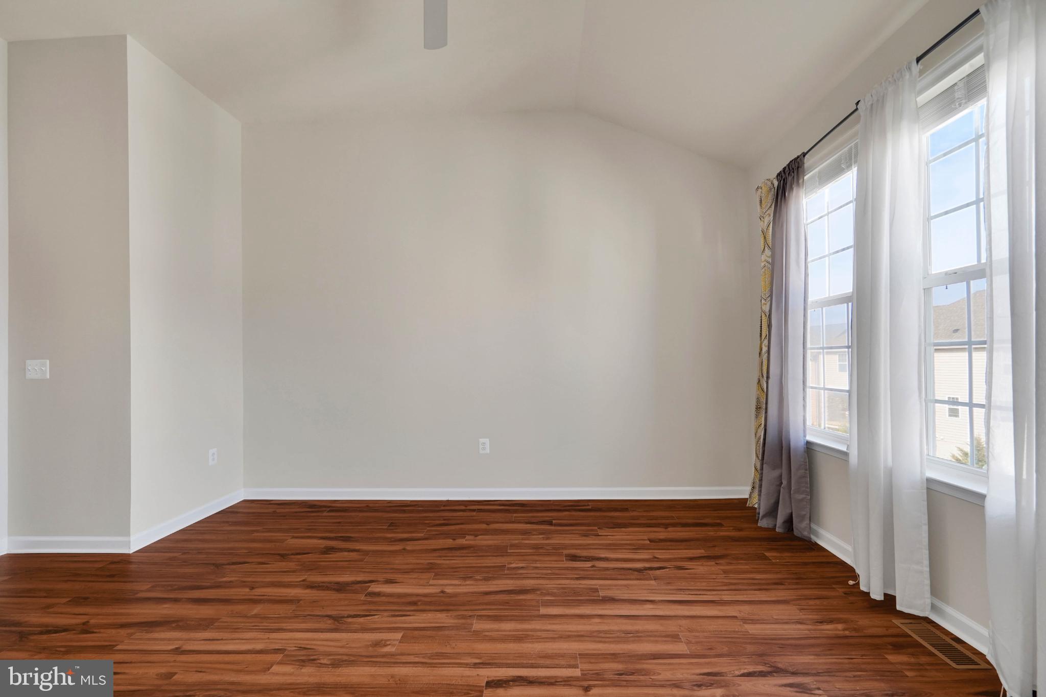 6 Lamplighter Lane Stafford, VA 22554 - Photo 27 of 37 a view of an empty room with wooden floor and a window