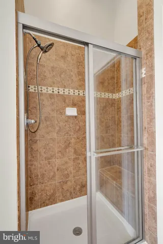 a bathroom with a glass shower door
