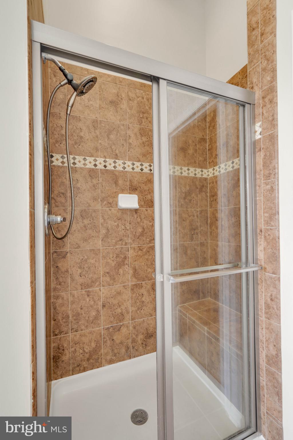 6 Lamplighter Lane Stafford, VA 22554 - Photo 31 of 37 a bathroom with a glass shower door