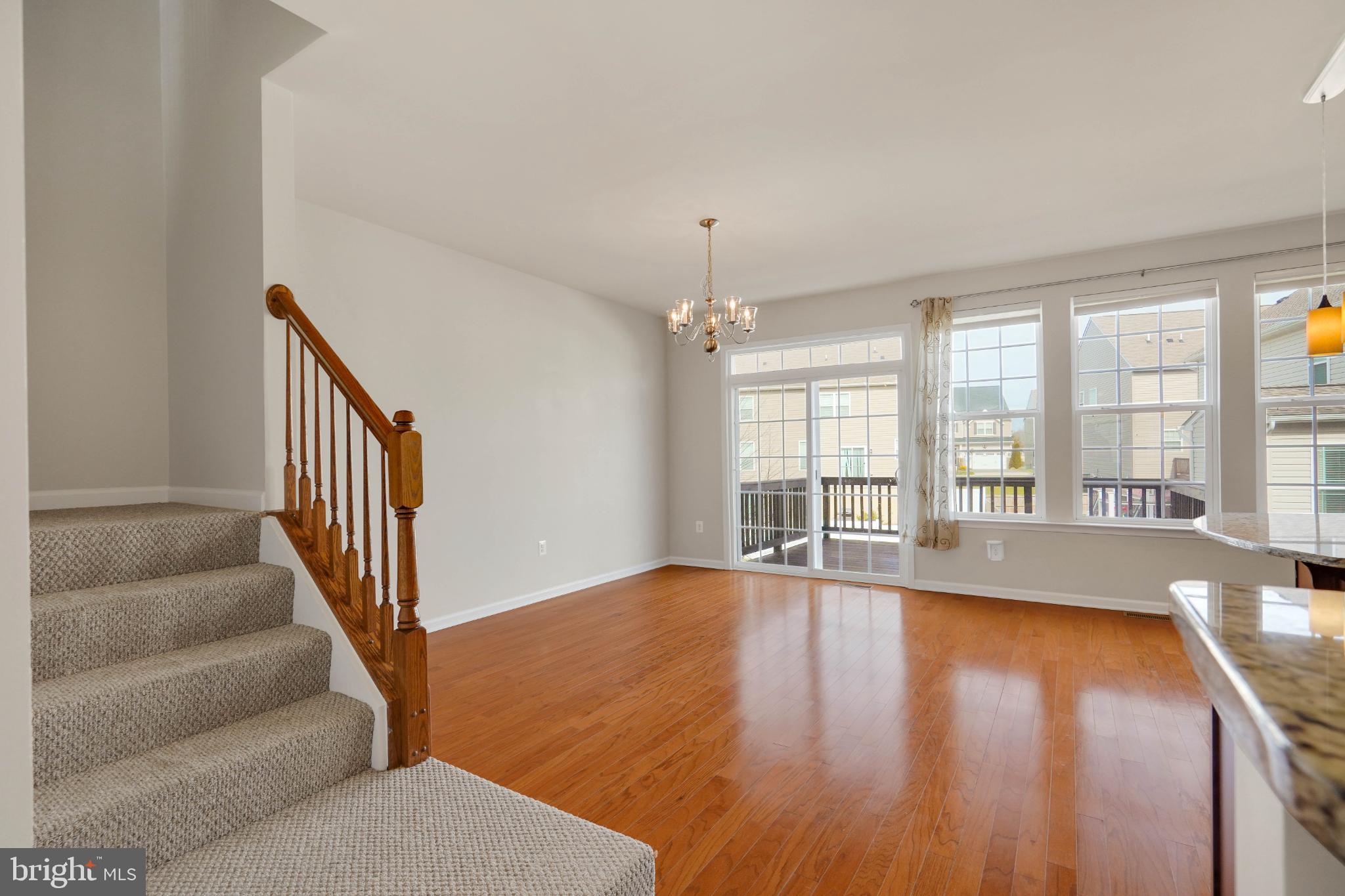 6 Lamplighter Lane Stafford, VA 22554 - Photo 8 of 37 a view of an empty room with wooden floor and a window
