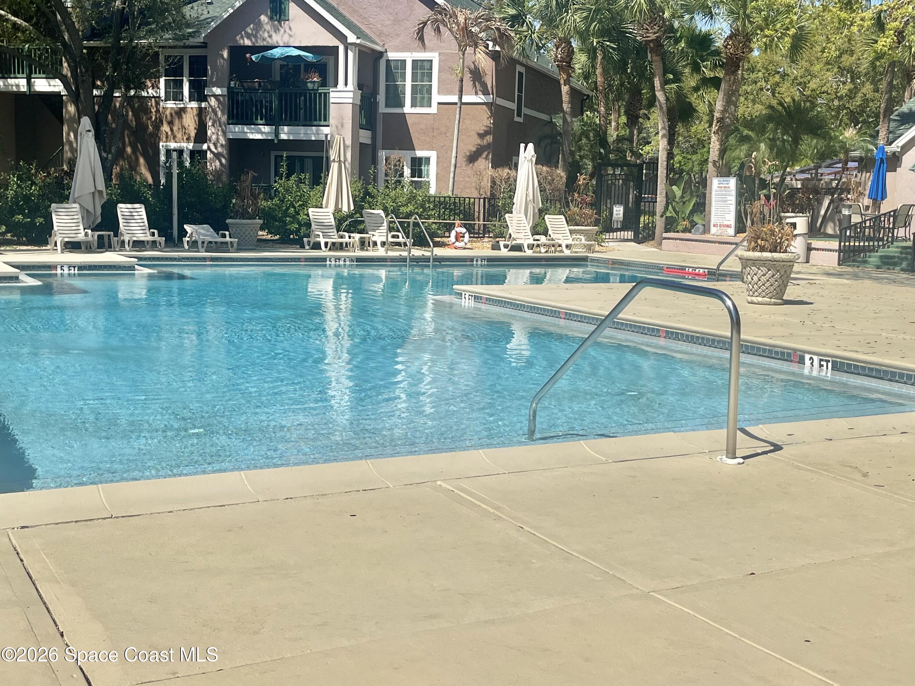 7667 North Wickham Road, Unit 1118 Melbourne, FL 32940 - Photo 18 of 26 swimming pool with outdoor view