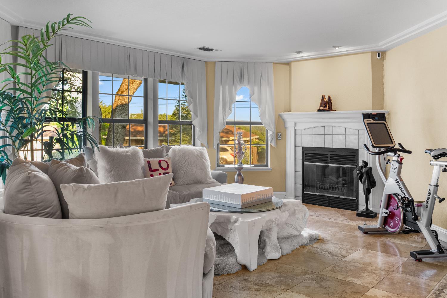 1801 Arroyo Drive Auburn, CA 95603 - Photo 11 of 68 a living room with furniture a flat screen tv and a floor to ceiling window