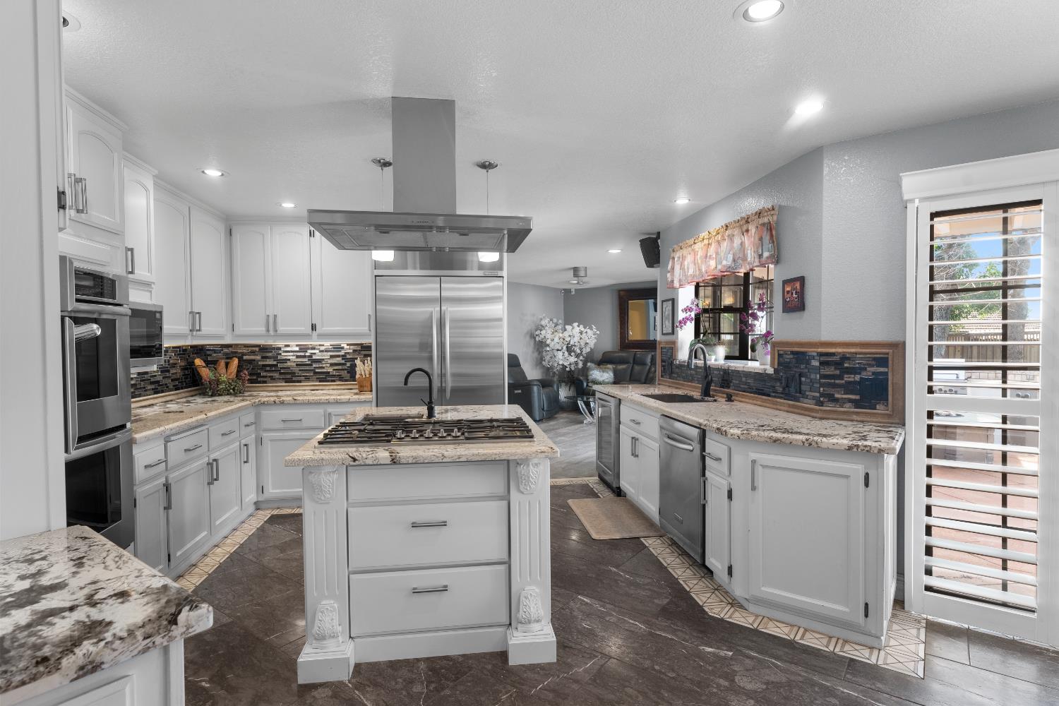 1801 Arroyo Drive Auburn, CA 95603 - Photo 15 of 68 a kitchen with stainless steel appliances granite countertop a stove oven and a refrigerator