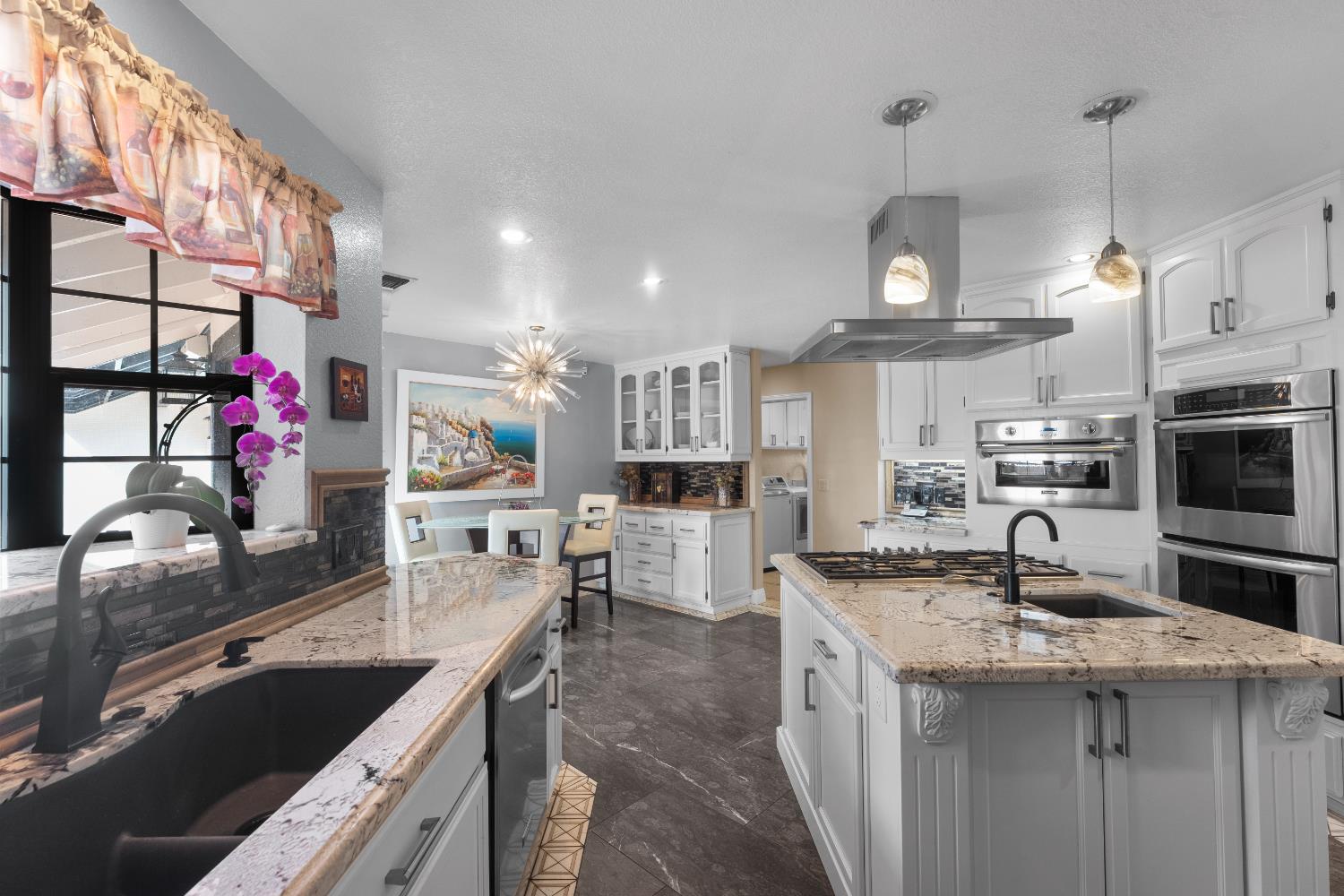 1801 Arroyo Drive Auburn, CA 95603 - Photo 17 of 68 a kitchen with stainless steel appliances a sink stove and cabinets