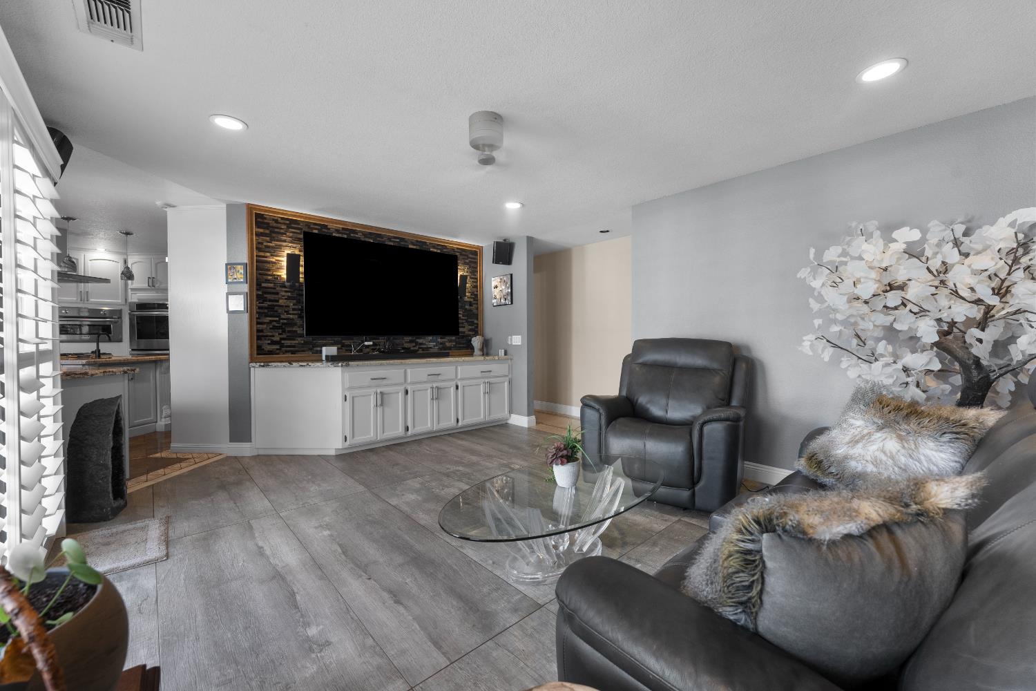 1801 Arroyo Drive Auburn, CA 95603 - Photo 25 of 68 a living room with furniture and a flat screen tv