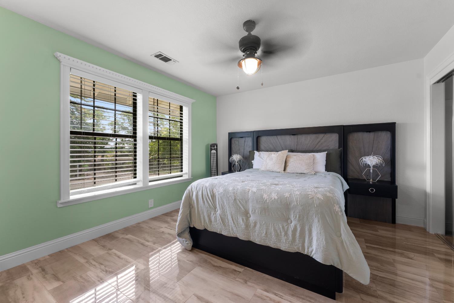 1801 Arroyo Drive Auburn, CA 95603 - Photo 31 of 68 a bedroom with a large bed and a window