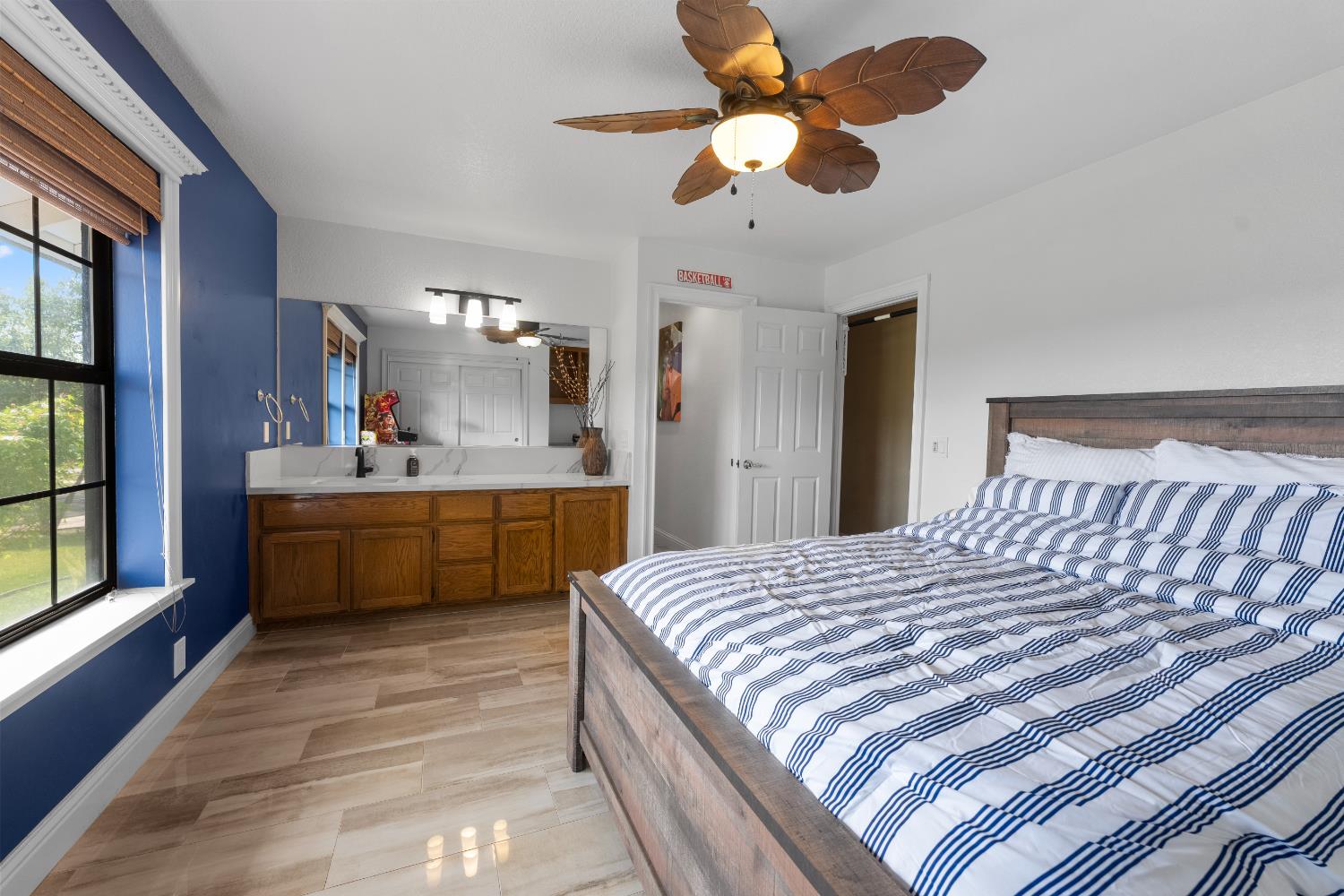 1801 Arroyo Drive Auburn, CA 95603 - Photo 35 of 68 a bedroom with a bed a chandelier and a dresser