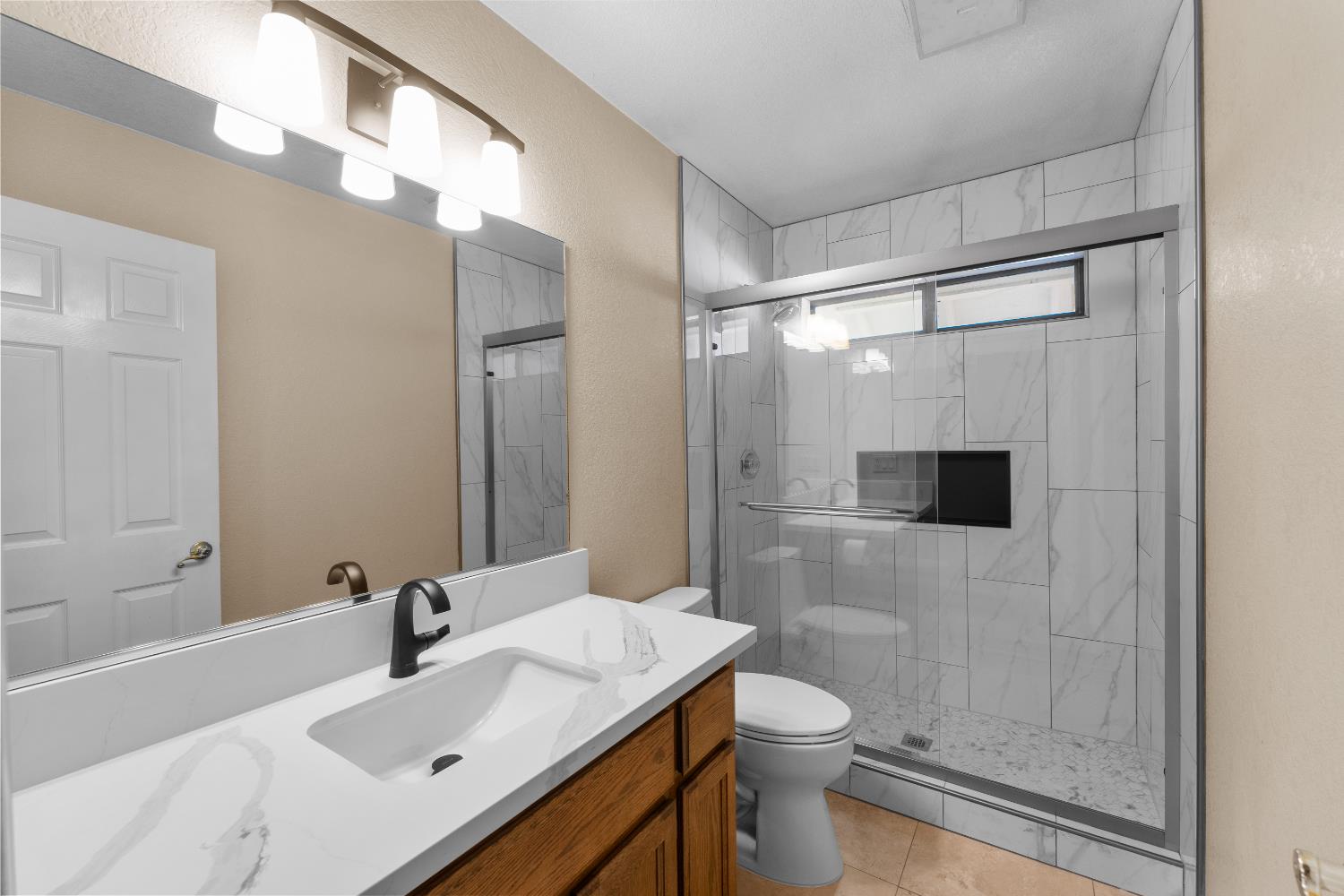 1801 Arroyo Drive Auburn, CA 95603 - Photo 37 of 68 a bathroom with a sink mirror toilet and shower