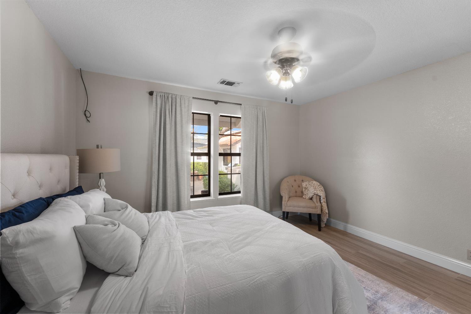 1801 Arroyo Drive Auburn, CA 95603 - Photo 38 of 68 a bedroom with a bed and a chair