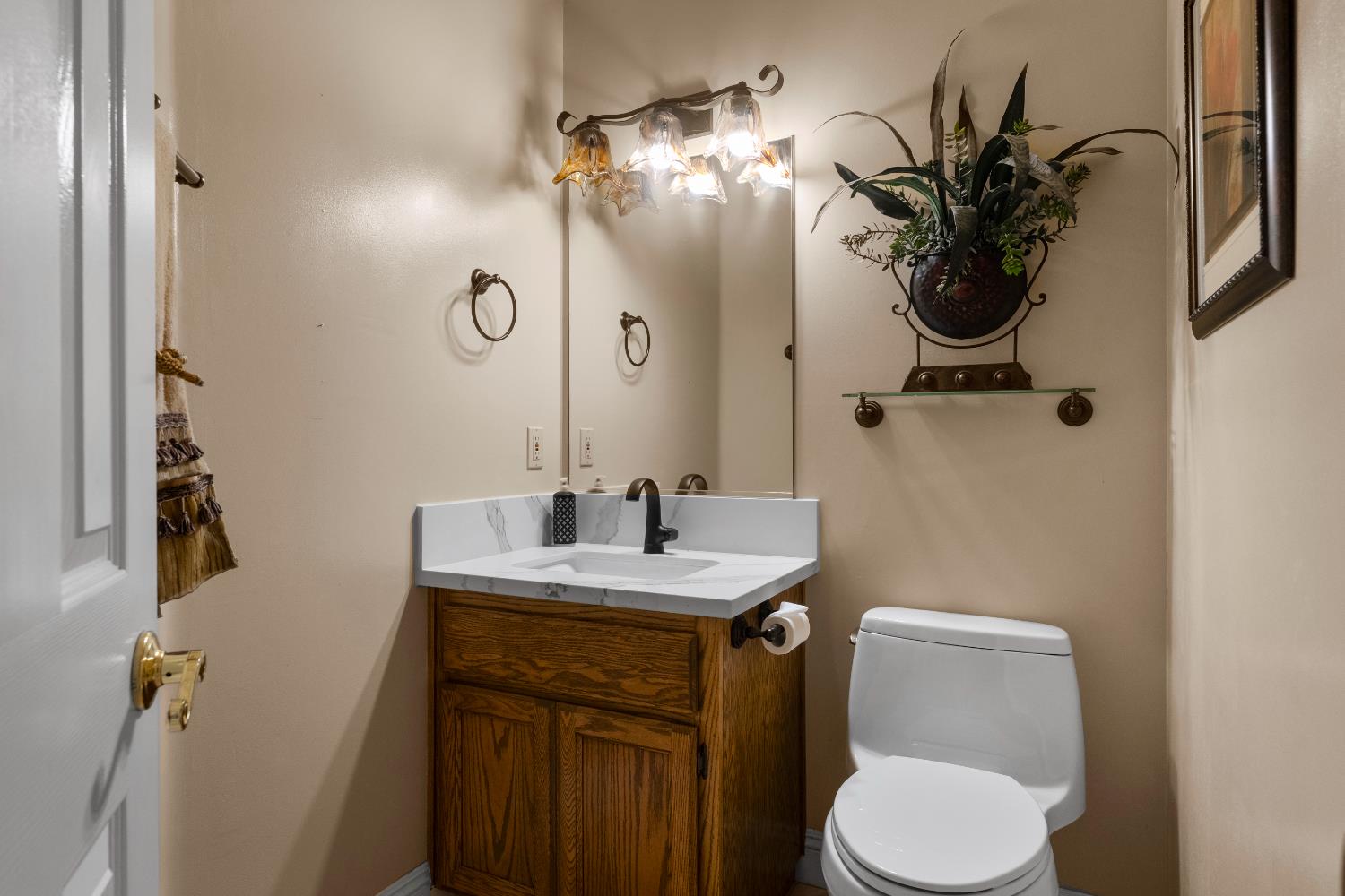 1801 Arroyo Drive Auburn, CA 95603 - Photo 40 of 68 a bathroom with a toilet sink and mirror