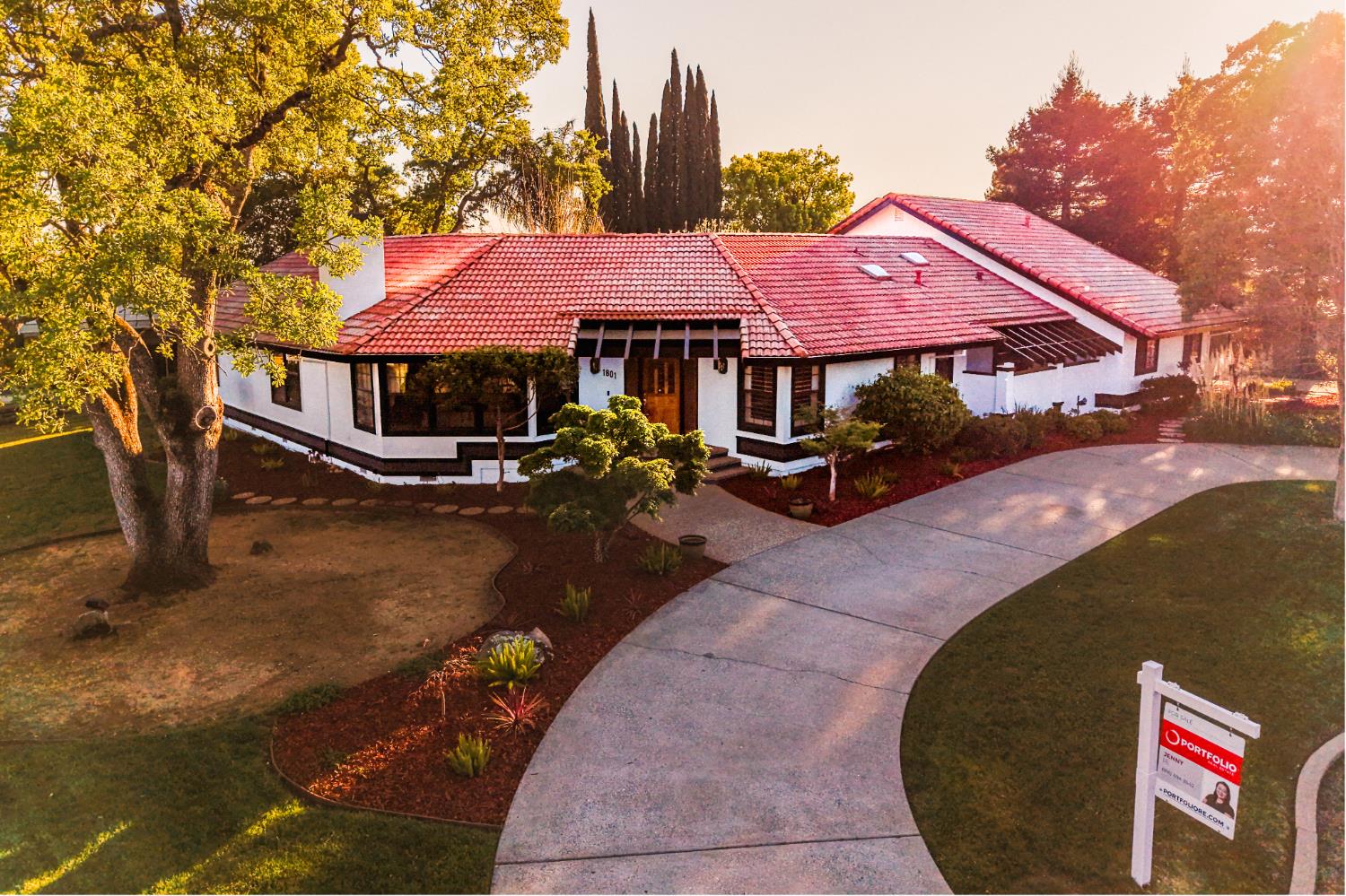 1801 Arroyo Drive Auburn, CA 95603 - Photo 67 of 68 a backyard of a house with table and chairs under an umbrella