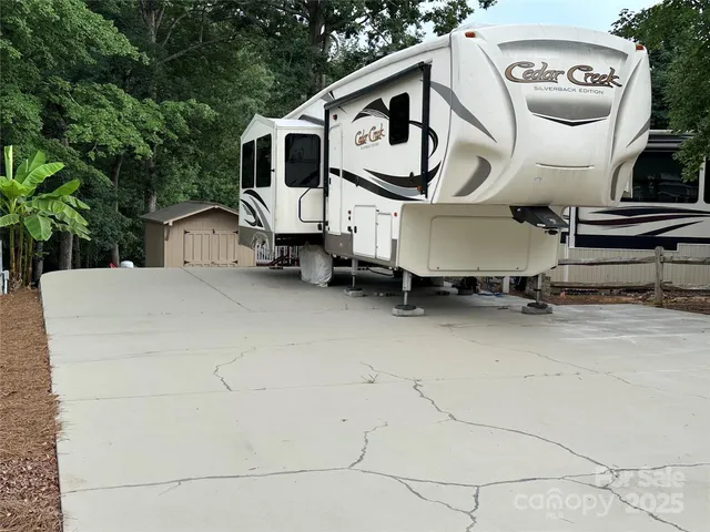 a view of a car park in front of house