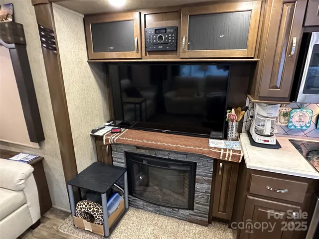 a white bed sitting in a bedroom next to a window