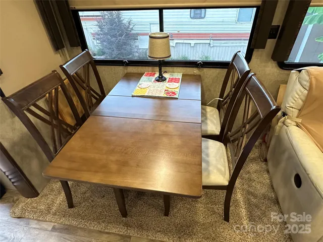 a kitchen with stainless steel appliances kitchen island granite countertop a refrigerator stove and sink