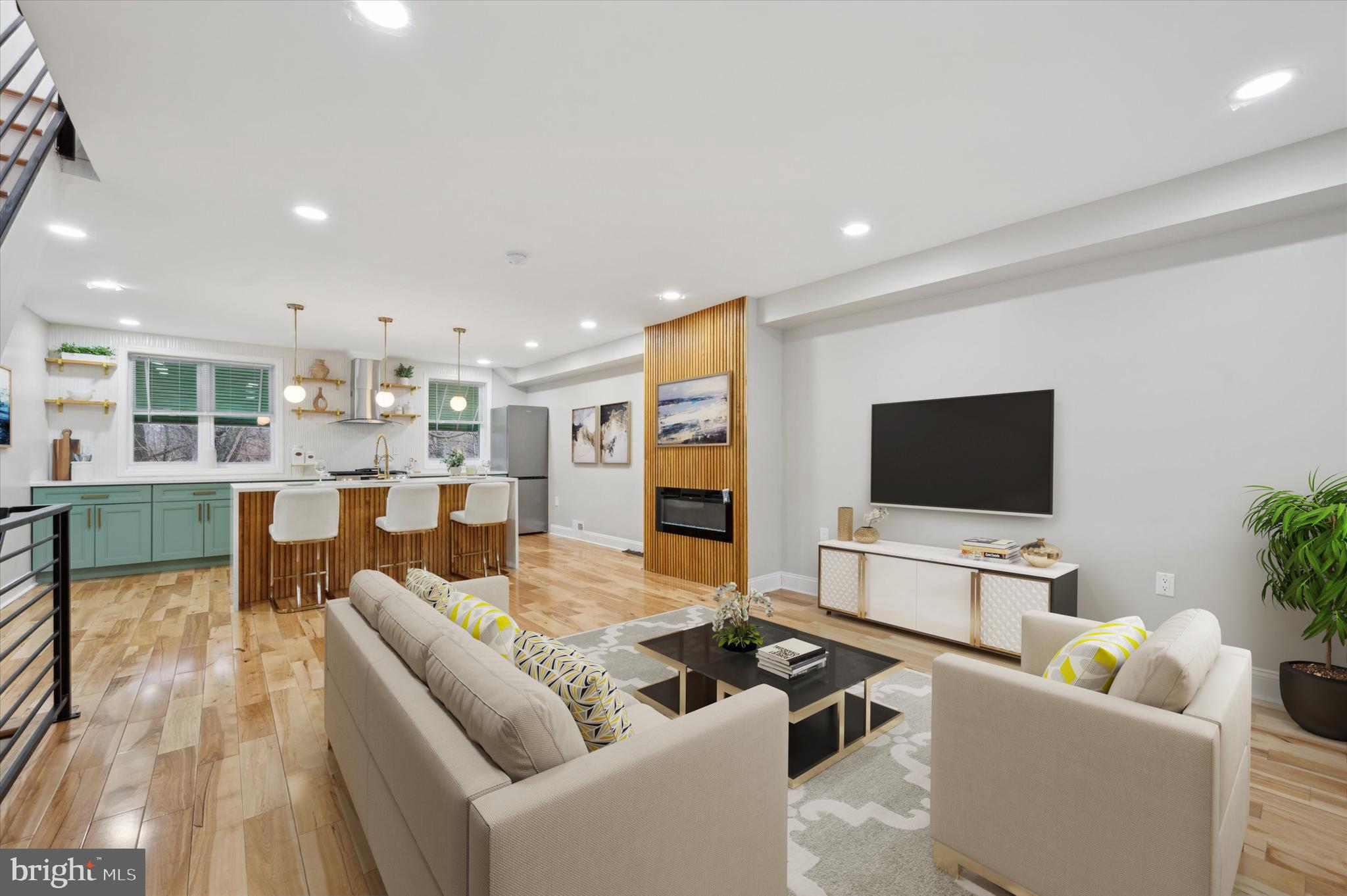 7533 Wheeler Street Philadelphia, PA 19153 - Photo 2 of 50 a living room with furniture and a flat screen tv