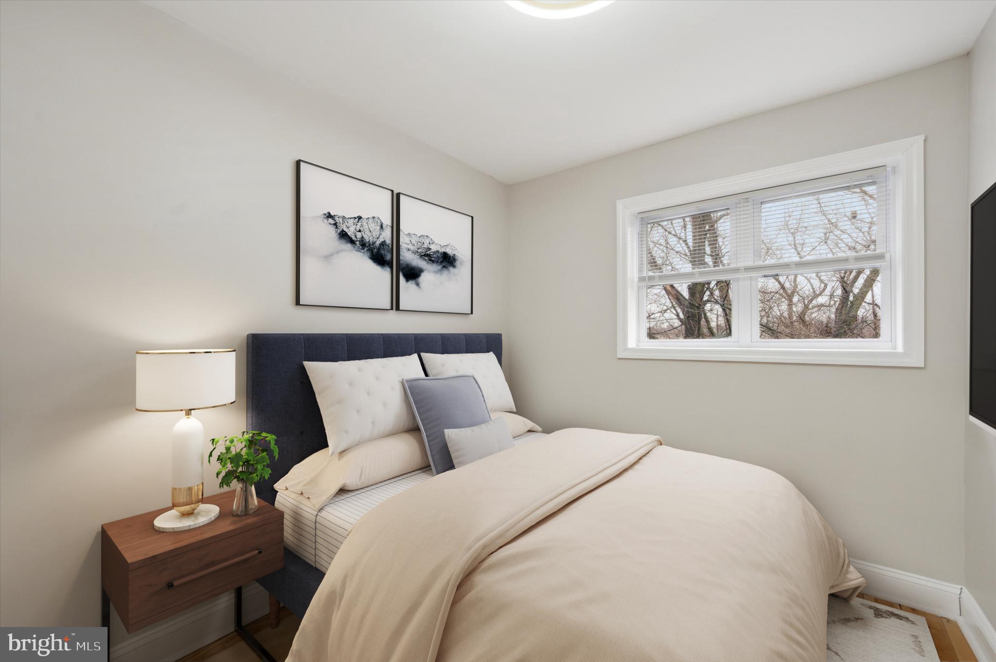 7533 Wheeler Street Philadelphia, PA 19153 - Photo 24 of 50 a bedroom with a bed and a wall painting