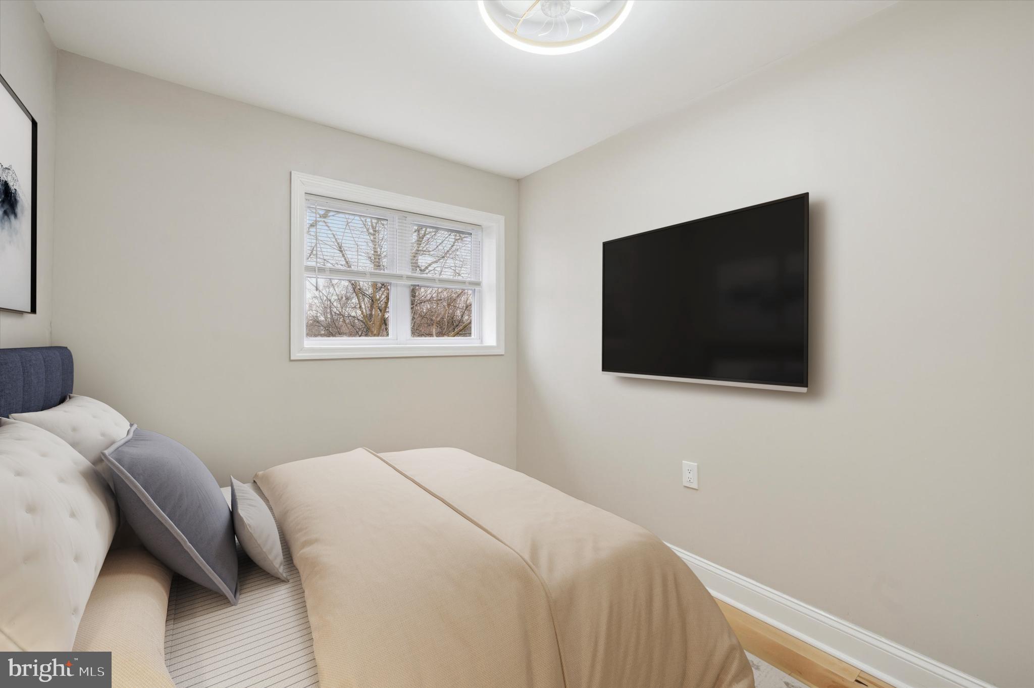 7533 Wheeler Street Philadelphia, PA 19153 - Photo 26 of 50 a bedroom with a bed and a flat screen tv