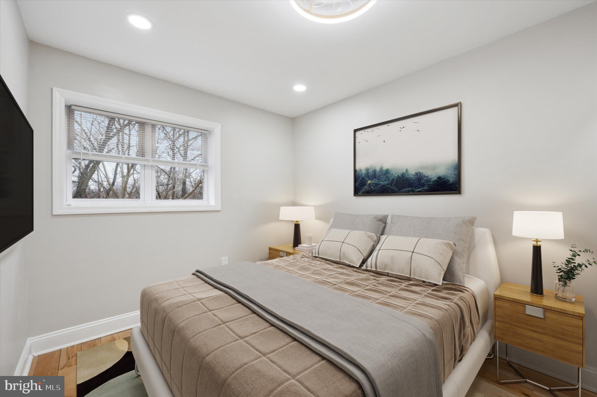 7533 Wheeler Street Philadelphia, PA 19153 - Photo 28 of 50 a bedroom with a bed and a painting on the wall