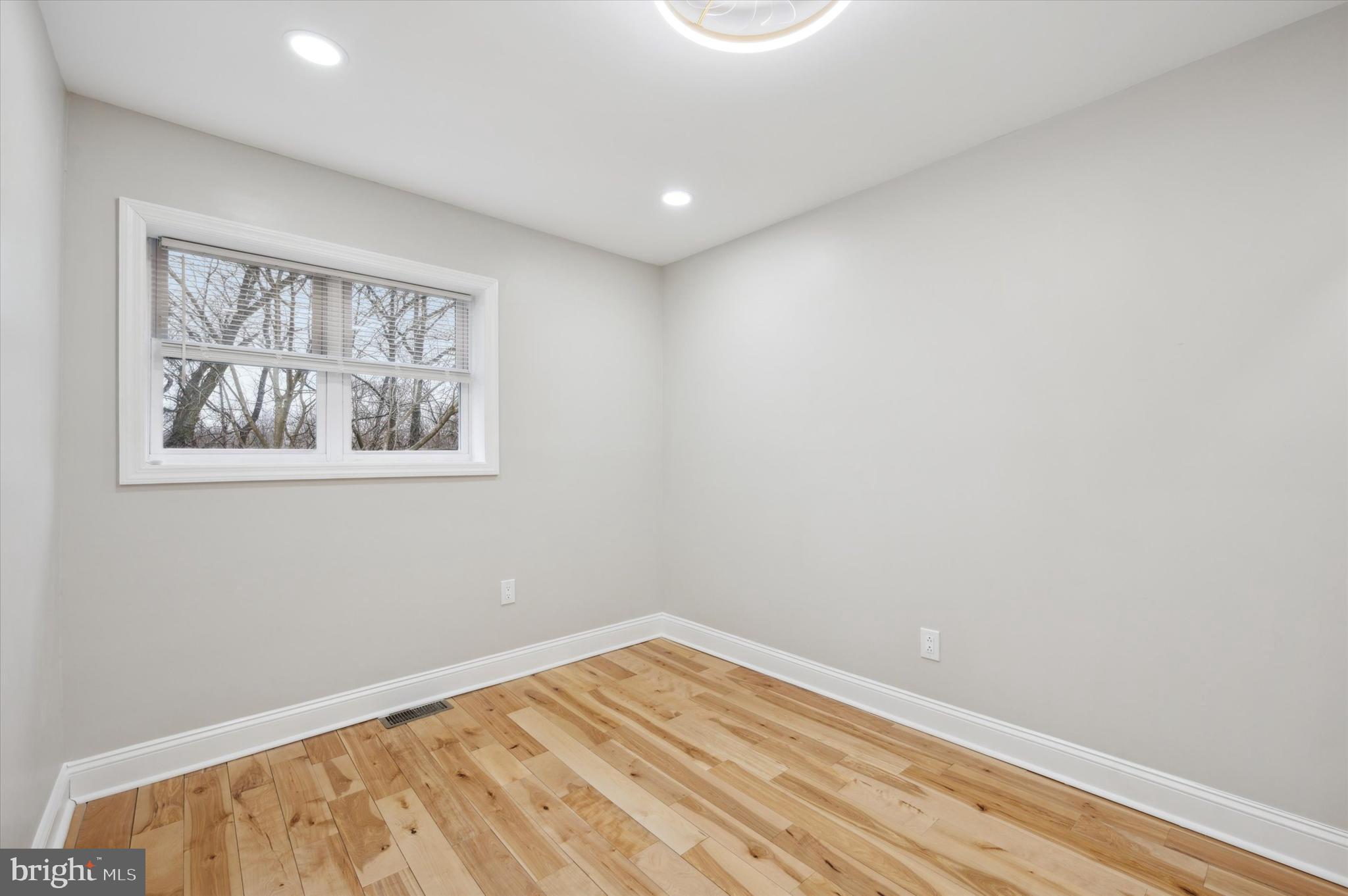 7533 Wheeler Street Philadelphia, PA 19153 - Photo 29 of 50 a view of empty room with wooden floor