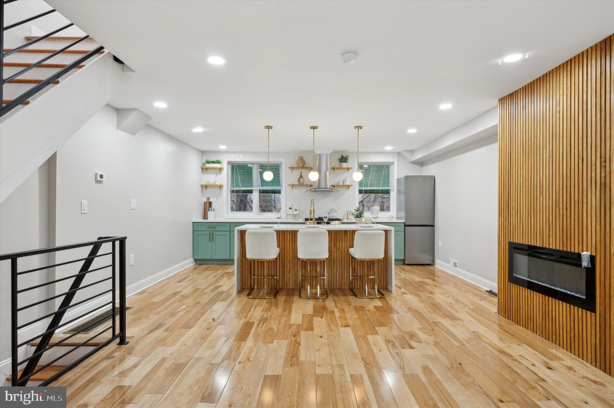7533 Wheeler Street Philadelphia, PA 19153 - Photo 5 of 50 a large kitchen with a table and chairs
