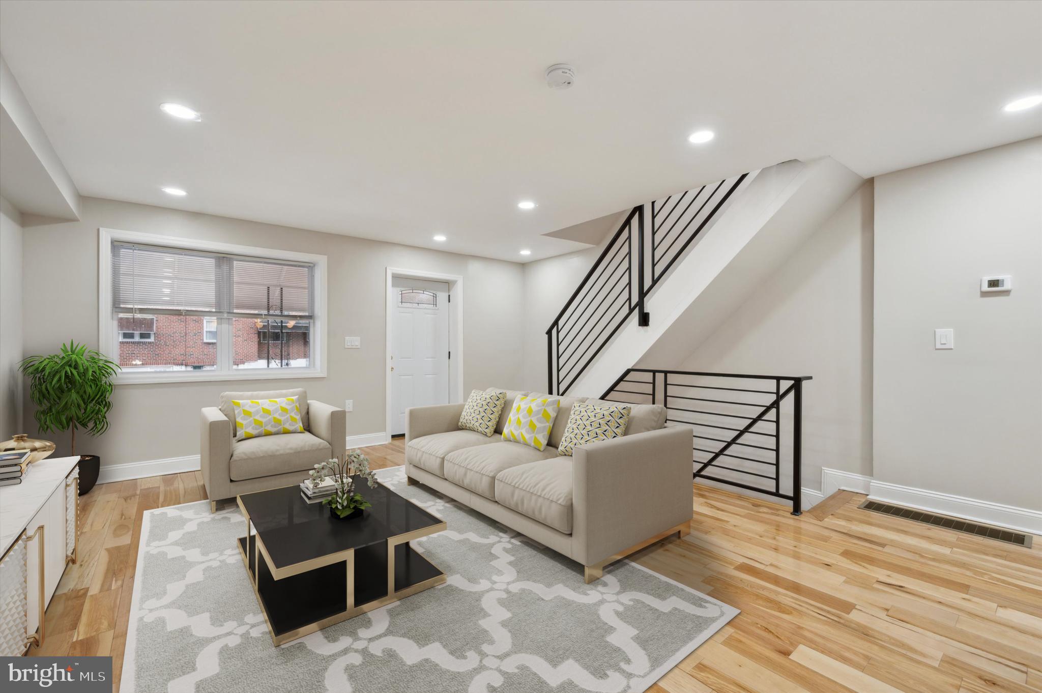 7533 Wheeler Street Philadelphia, PA 19153 - Photo 10 of 50 a living room with furniture and wooden floor