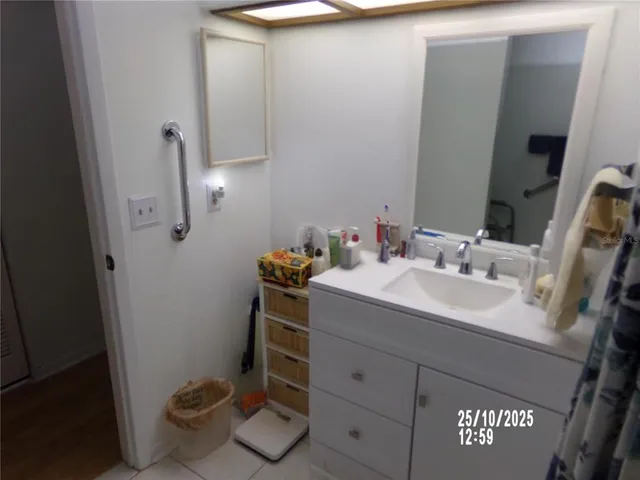 a bed sitting in a room next to a window