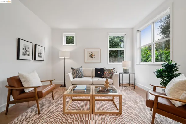 a living room with furniture and a rug