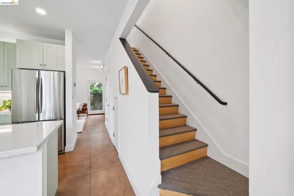 a bedroom with bed and windows