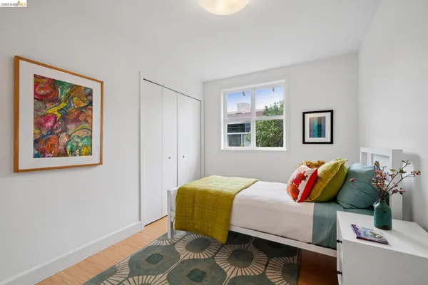 a bedroom with a bed and a window