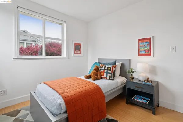 a bed room with two bed and a closet