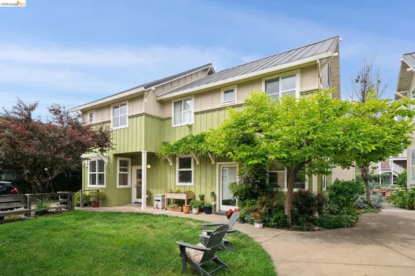 a front view of a house with trees