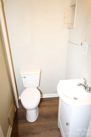 a white toilet sitting next to a bathroom sink