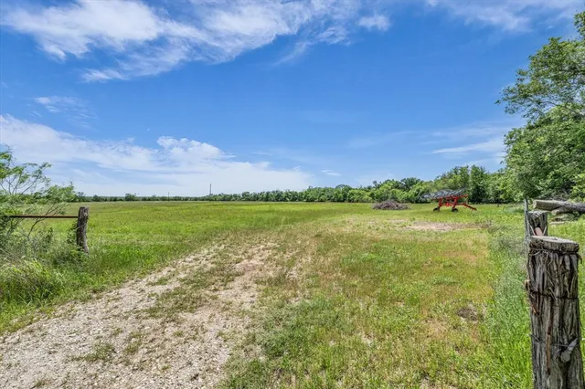 a view of a lake with a yard