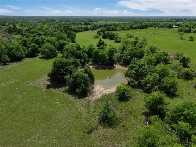 a view of a lake with a big yard