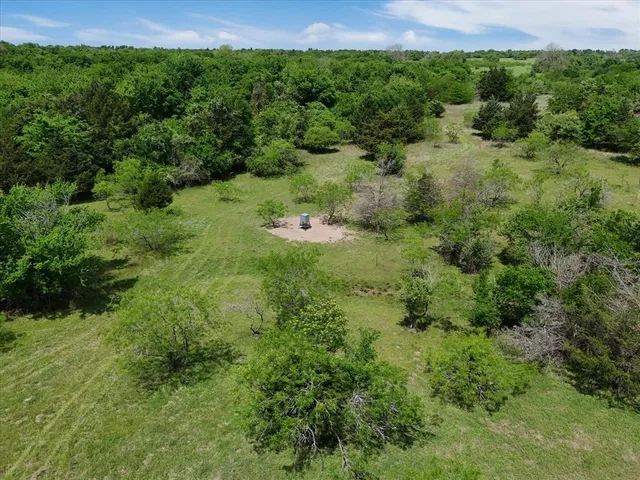 a view of a lake with a yard