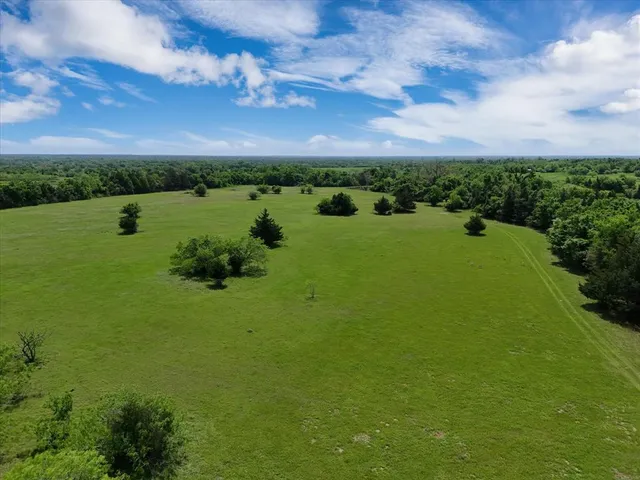 a view of a lake with a yard