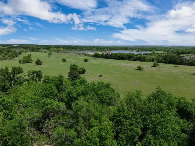 a view of a lake with a big yard