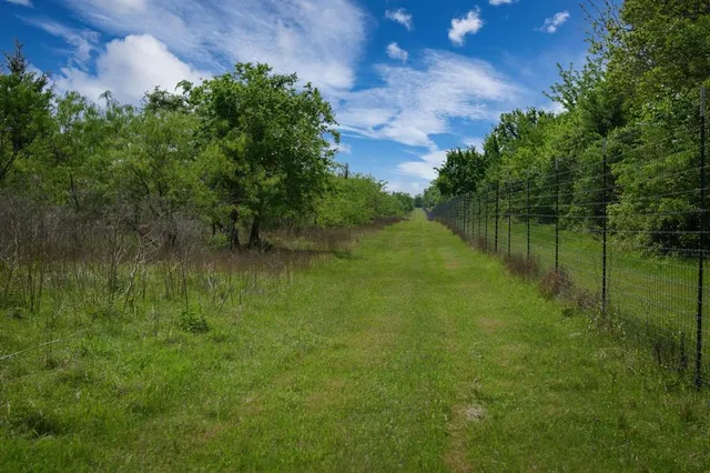 a view of a lake with a yard