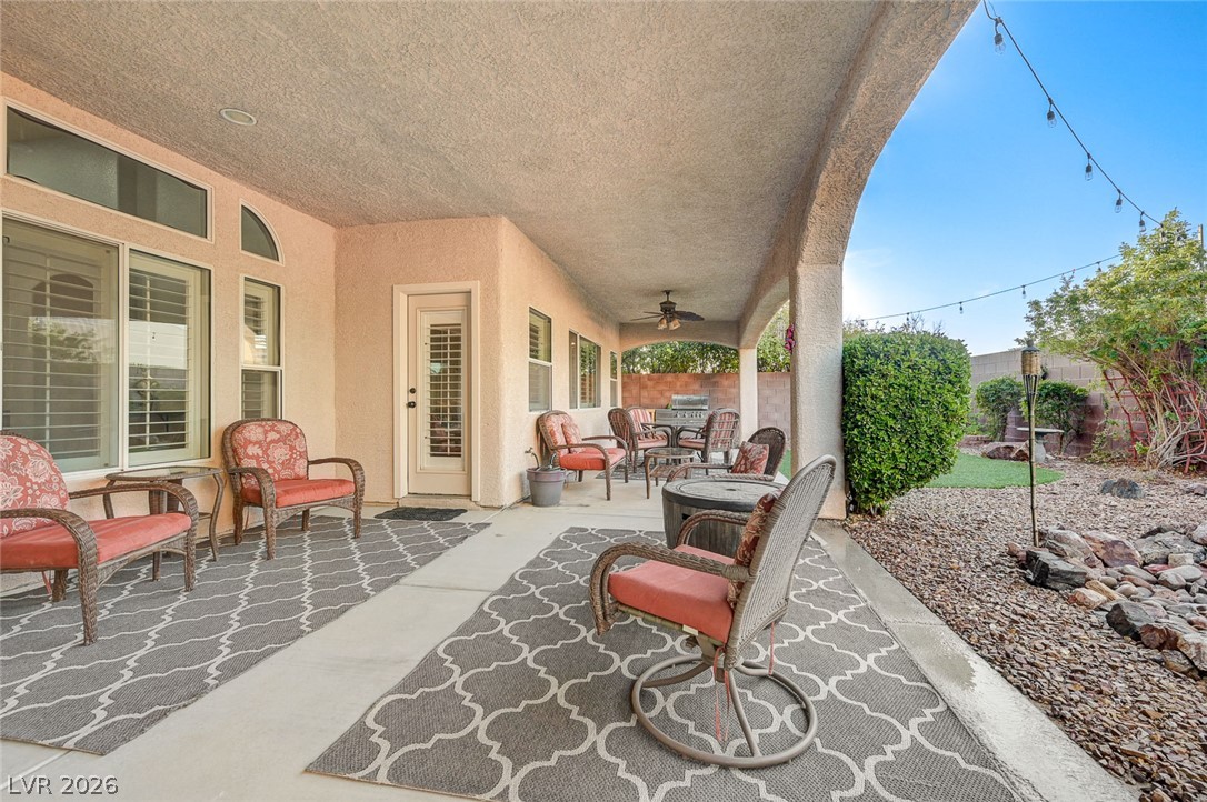1604 Cattle Ranch Place Henderson, NV 89002 - Photo 80 of 99 An inviting covered patio offers a comfortable outdoor living space for relaxation and entertainment.