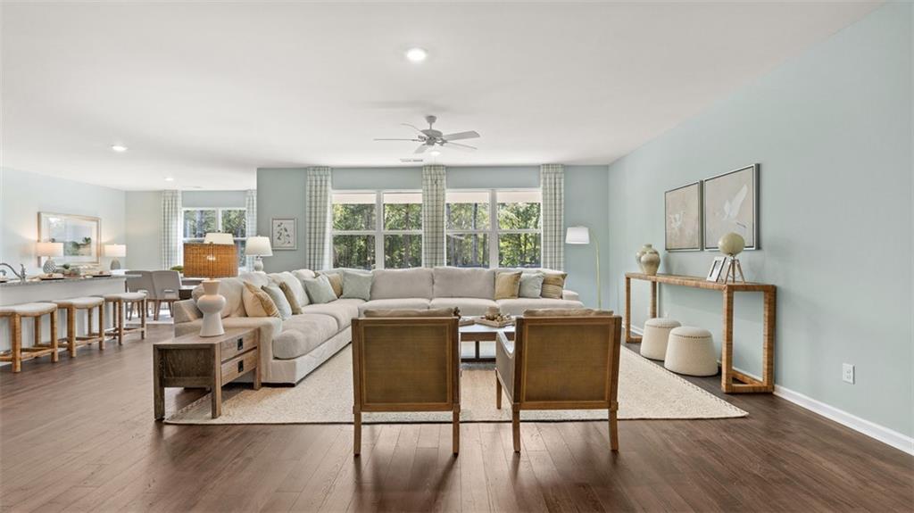 365 Bullock Pass Jefferson, GA 30549 - Photo 15 of 67 a living room with furniture a dining table wooden floor and a large window