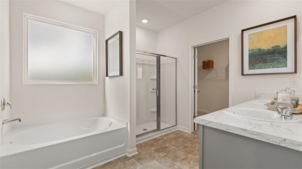 365 Bullock Pass Jefferson, GA 30549 - Photo 28 of 67 a bathroom with a bathtub and a sink