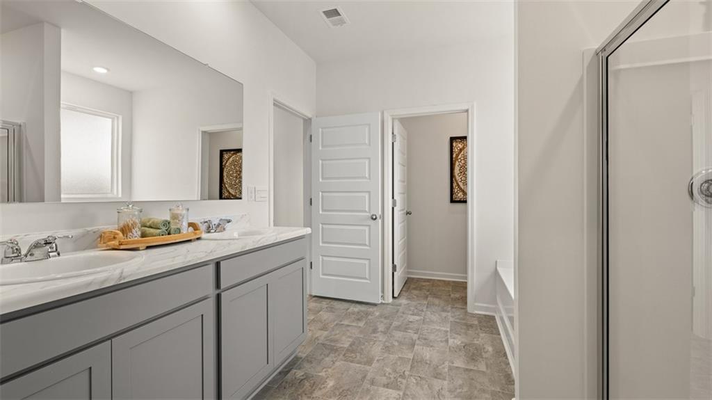 365 Bullock Pass Jefferson, GA 30549 - Photo 30 of 67 a bathroom with a sink and a mirror