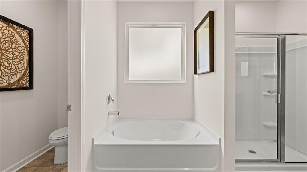 365 Bullock Pass Jefferson, GA 30549 - Photo 31 of 67 a bathroom with a bathtub and a shower