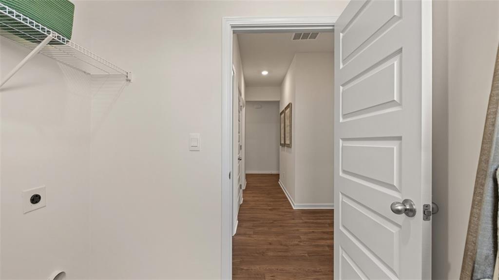 365 Bullock Pass Jefferson, GA 30549 - Photo 45 of 67 a view of a hallway with wooden floor and closet area