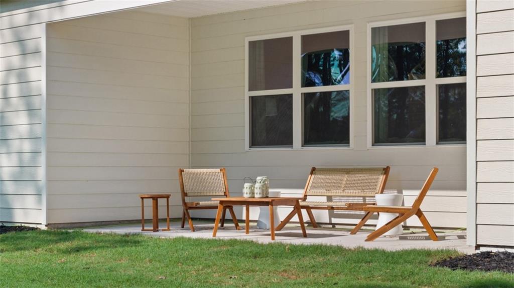 365 Bullock Pass Jefferson, GA 30549 - Photo 49 of 67 a view of a chairs and table in backyard of the house