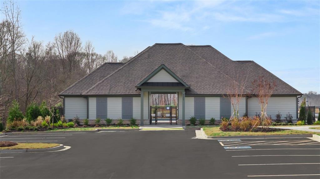 365 Bullock Pass Jefferson, GA 30549 - Photo 52 of 67 a front view of a house with a yard and garage