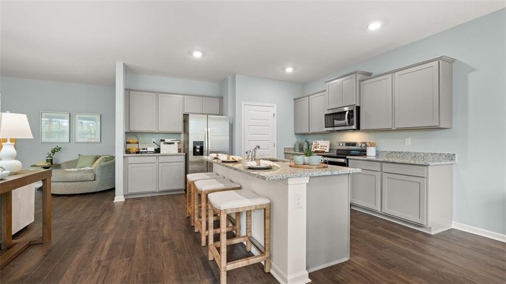 365 Bullock Pass Jefferson, GA 30549 - Photo 8 of 67 a kitchen with white cabinets and stainless steel appliances