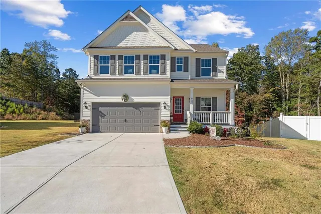 front view of a house with a yard